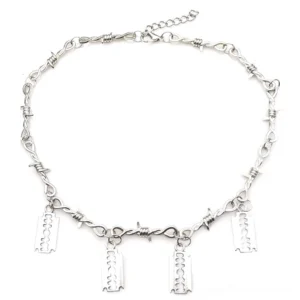 Unisex gothic choker with barbed chain and four blade pendants, flat lay overhead view showing adjustable extension chain and silver metal finish
