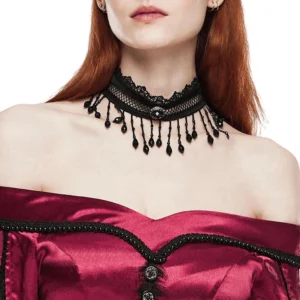 Close-up neck detail of Victorian lace choker with beaded tassels, styled with burgundy off-shoulder dress