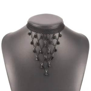 Gothic choker necklace displayed on mannequin bust showing woven lace strap and dangling beaded tassel design