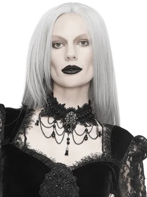 Gothic black lace choker necklace styled with lace-trimmed dark fashion dress - front view on white background