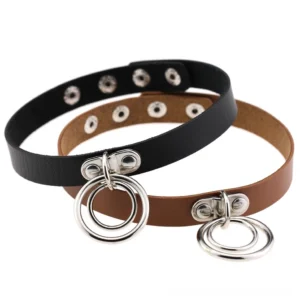 Multiple gothic PU leather chokers with metal rings in various colors displayed on white background, showing design versatility
