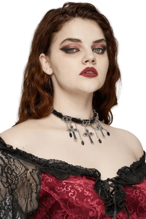 Side profile view of gothic cross choker styled with off-shoulder retro red lace dress