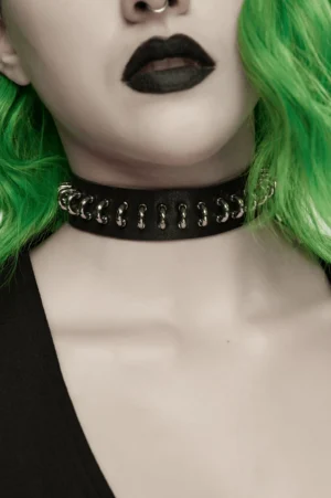 Black leather gothic choker with double silver ring links, close-up front neck view on model with green hair