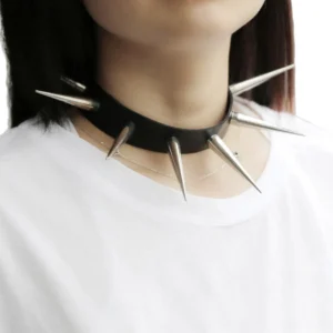 Black studded leather gothic choker with silver metal spikes, worn on model showing close-up detail of spike construction and leather texture