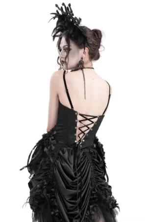 Back view of black feather corset with back lace-up system and asymmetrical ruffled hem on model