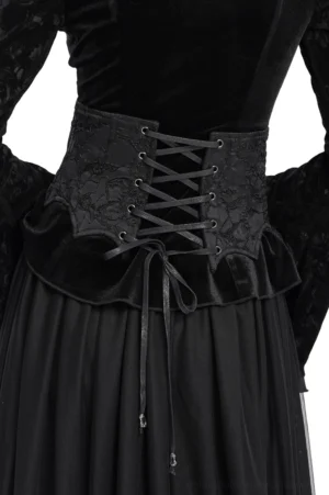 Gothic corset belt back view on model showing crisscross lace-up tie with pendant, ruffled hem design and black finish