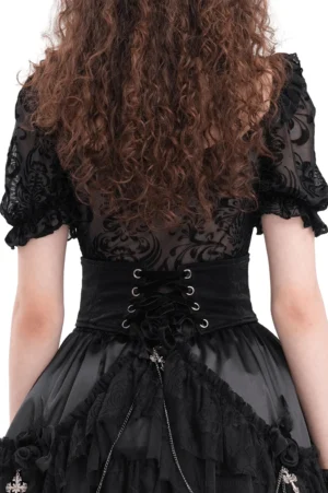 Gothic corset belt back lace-up design with tassels on model wearing ruffled skirt