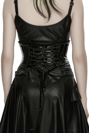 Back view of patent leather corset belt with lace-up drawstring design and glossy black finish on model