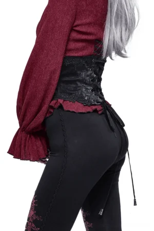 Black gothic corset belt side and back view on female model, displaying back lace-up design paired with casual wear