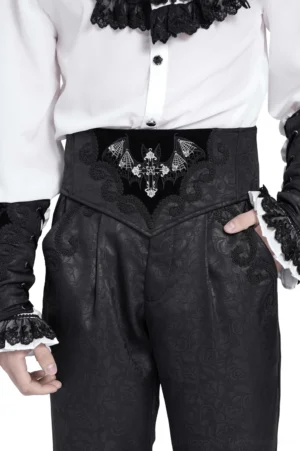 Black velvet gothic corset belt with embroidered bat wings and cross, front detail view showing silver embroidery on jacquard fabric