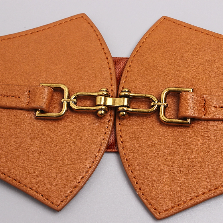 Tan gothic corset belt flat lay - detailed top-down view showing stitching and gold metal hardware