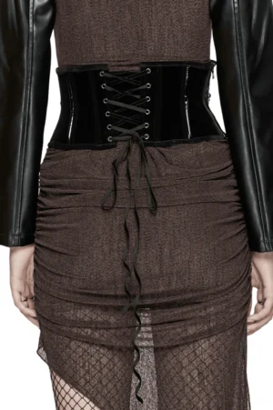 Black velvet gothic corset belt back view showing lace-up closure, patent leather back panel, and adjustable drawstring design on model
