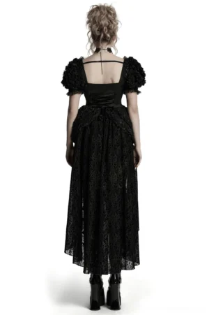 Back view of black gothic lace dress showing square neckline and voluminous 3D skirt on model with gothic fashion styling