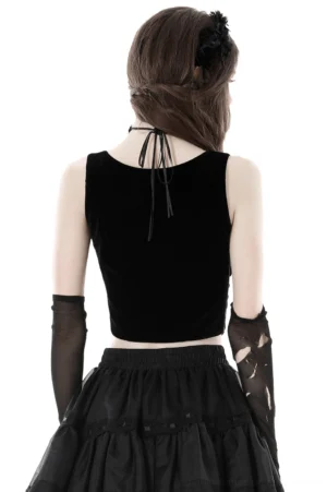 Gothic black velvet corset with halter tie back closure shown in rear full-body view on model against white background