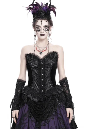 Black lace-up gothic corset with ruffled hem and satin straps, styled as a complete gothic ensemble with feathered headpiece and dramatic styling