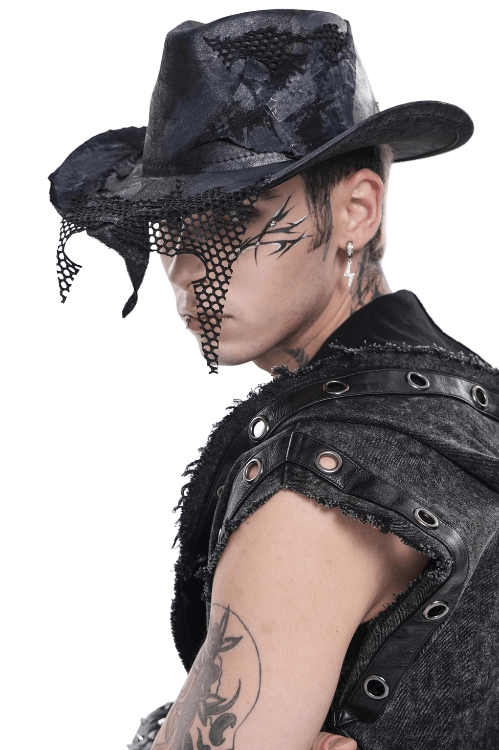 Black gothic cowboy hat with distressed mesh patch details, left profile view on tattooed male model