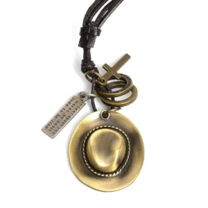 Gothic cowboy hat pendant necklace with cross and ring charms, antique bronze copper alloy finish on adjustable leather rope chain, front flat lay view