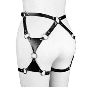 Crisscross waist and thigh harness on mannequin, rear view, featuring geometric strap pattern and silver ring buckles