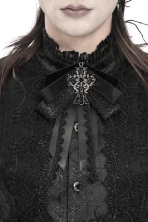 Gothic cross ribbon brooch with lace trim worn on black lace high-neck shirt, front close-up detail view
