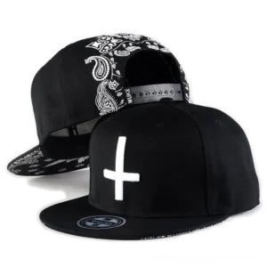 Gothic cross embroidery snapback baseball cap black - front and side view with white paisley and cross stitching detail