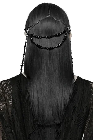 Black gothic cross tassel headpiece back view on model with long black hair, displaying back head harness and cascading tassel chains