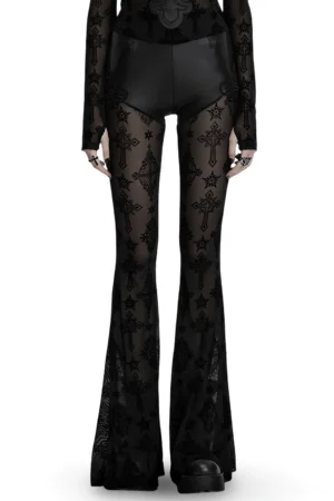 Gothic cross flocked mesh flare pants front view on model - black faux leather waistband with sheer embroidered mesh legs