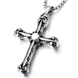 Vintage gothic cross pendant in 925 sterling silver with ornate carved details and central stone inlay, overhead studio view