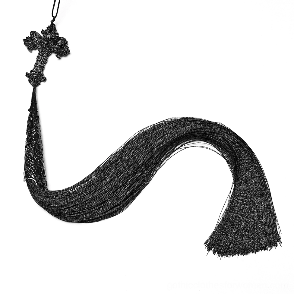 Close-up detail of ornate carved cross pendant and flowing silk tassel on gothic feather fan