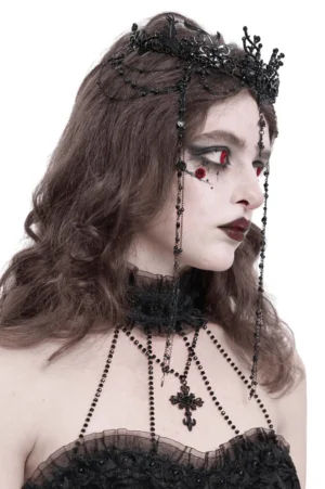 Side profile of gothic black lace crown with long cascading beaded forehead chains on female goth model