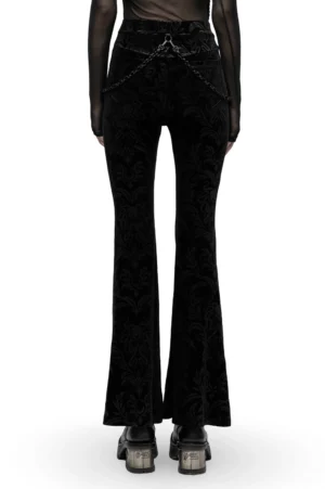 Black gothic flared pants with damask velvet and chain belt - back full-length view on model