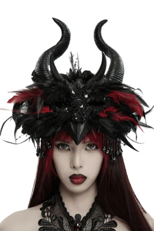 Gothic demon horned headpiece with dual black curved horns, red and black feathers, sequined floral base, and beaded tassels - front close-up portrait view