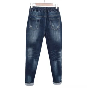 Distressed gothic jeans back view showing two rear pockets and rolled cuffs with dark wash finish