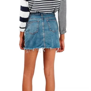 high-waist denim mini skirt back view showing dual pockets and raw hem detail alternative fashion