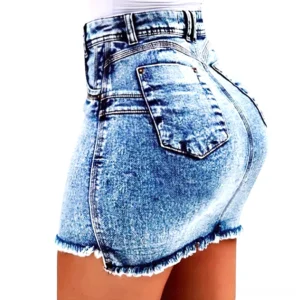 Medium blue denim gothic mini skirt with back patch pocket detail and frayed hem, shown from rear side view