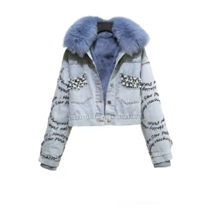 Blue gothic denim parka with light blue fox fur collar and pearl beaded pocket details, front flat lay view