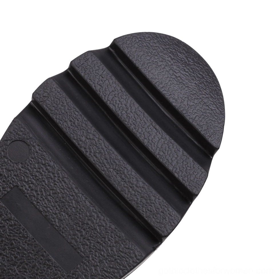 Close-up of gothic dragon platform boots black rubber outsole with deep anti-slip lug pattern