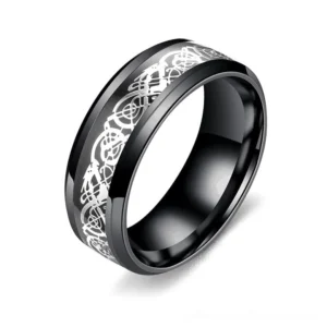 Black stainless steel gothic dragon ring, three-quarter view showing beveled edges and silver dragon engraving detail