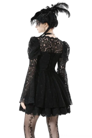Black gothic lace mini dress - back view on model displaying lace yoke and back corset lacing with feathered gothic hat