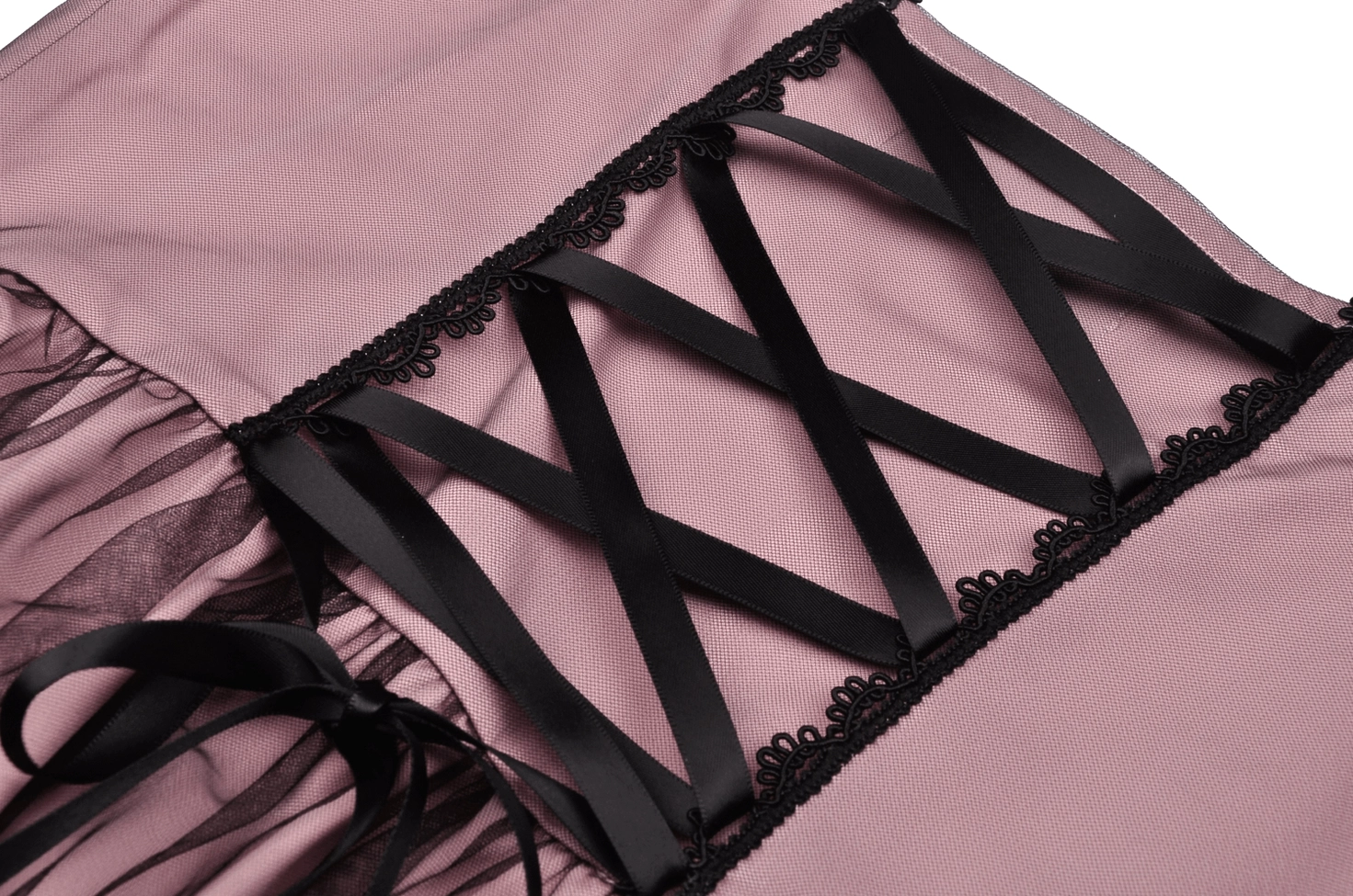 Side view close-up of corset lace-up and tulle skirt with black lace edge on gothic mini dress
