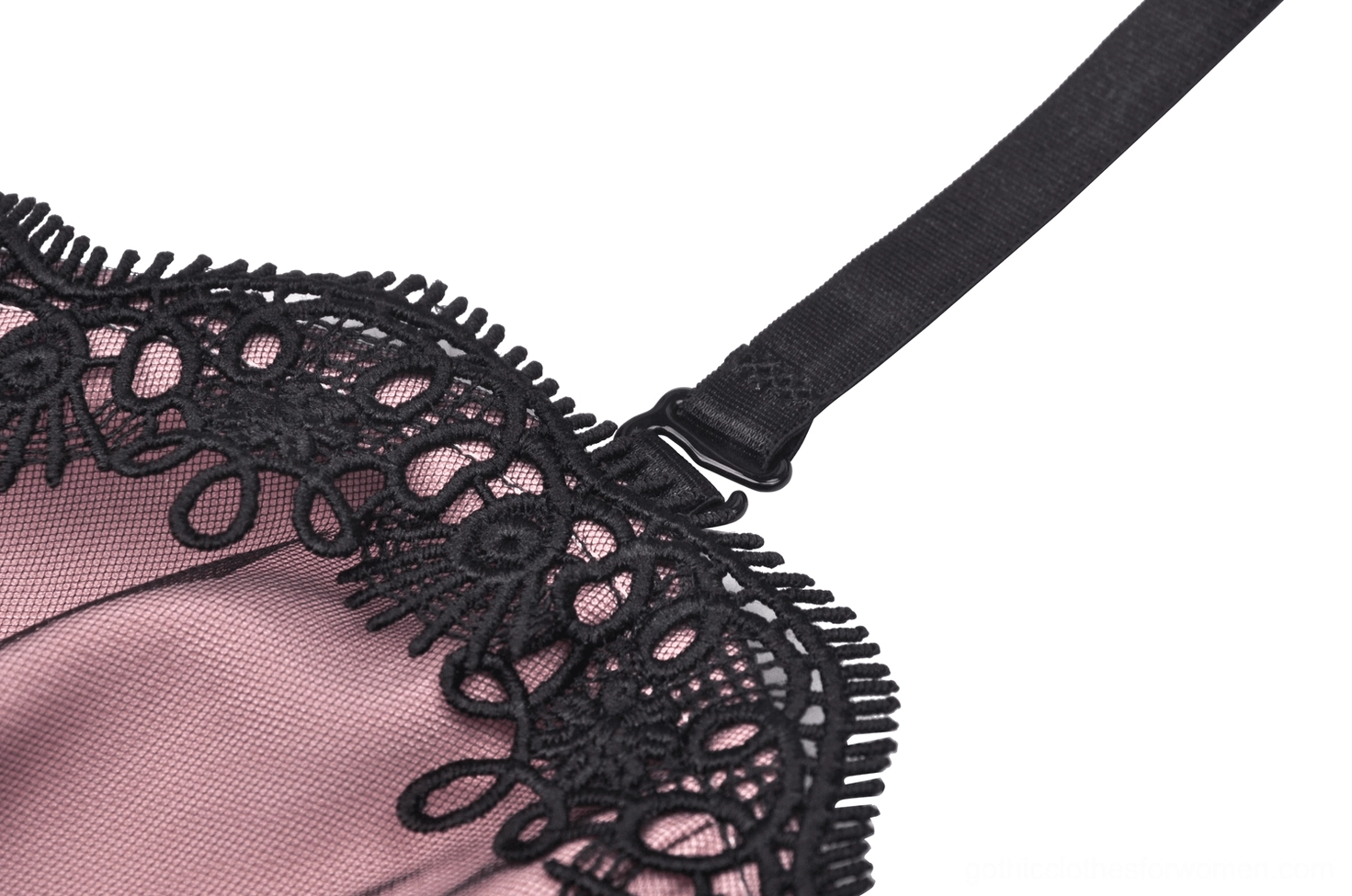 Close-up of adjustable spaghetti strap and ornate black lace edge on gothic corset dress