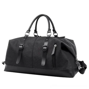 Black gothic travel duffel bag with leather trims, side three-quarter view showcasing dark academia aesthetic and side zipper pocket
