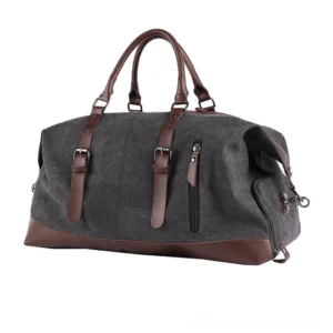 Brown oxford canvas travel duffel bag with dark leather accents, front three-quarter view displaying rich gothic style