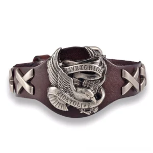 Coffee brown leather gothic rider bracelet with silver eagle badge and cross-stitched details, overhead flat lay on white studio background