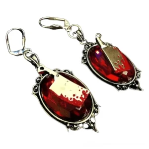 Red variant bloody cleaver earrings with blood-splatter details, overhead angle showcasing two-tone metal design