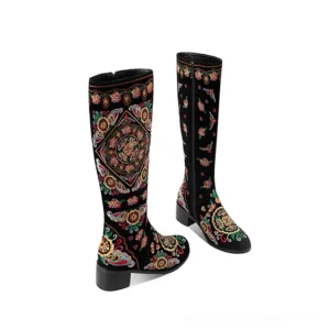 Pair of black gothic embroidered knee-high boots with zipper closure, displaying full floral embroidery pattern and chunky heels from flat view