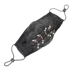 Left side profile of black gothic face mask displaying adjustable elastic ear loops and metal piercing trim accents on pure white background