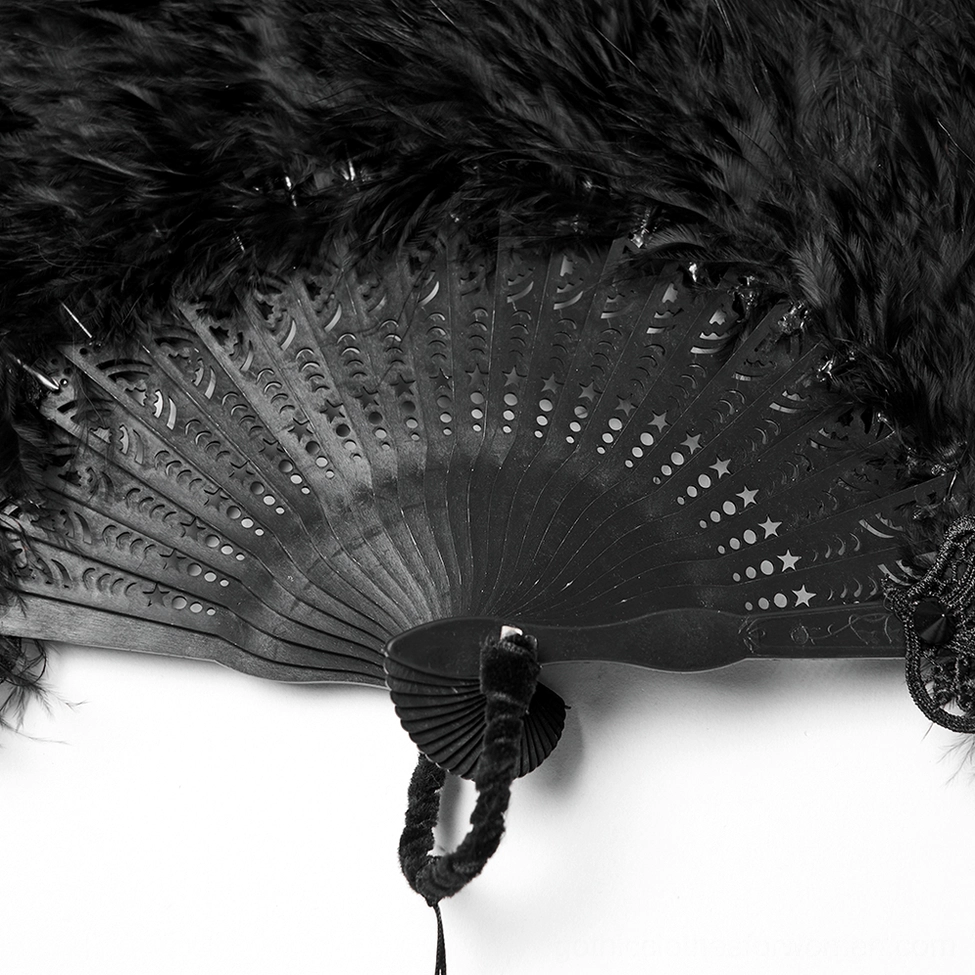 Overhead close-up of gothic fan frame ribs with star and moon carved details and woven hanging loop