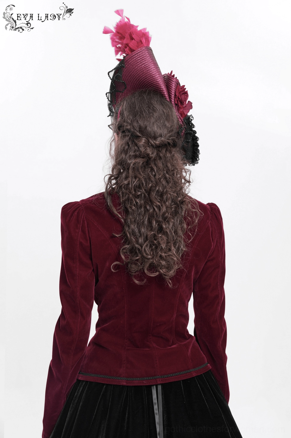 Fascinator construction detail showing fabric flower arrangements and feather accent placement on burgundy black gothic headpiece