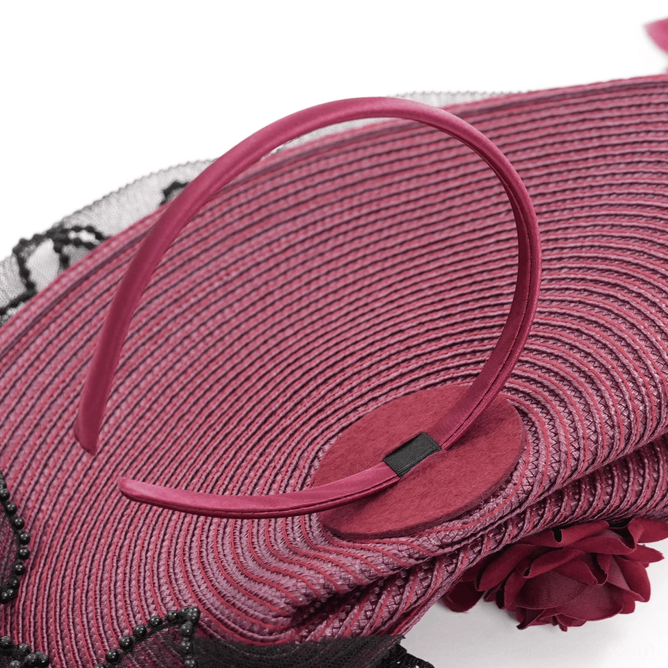 Side angle detail showcasing lace veil intricacy and feather plume movement of burgundy black gothic fascinator