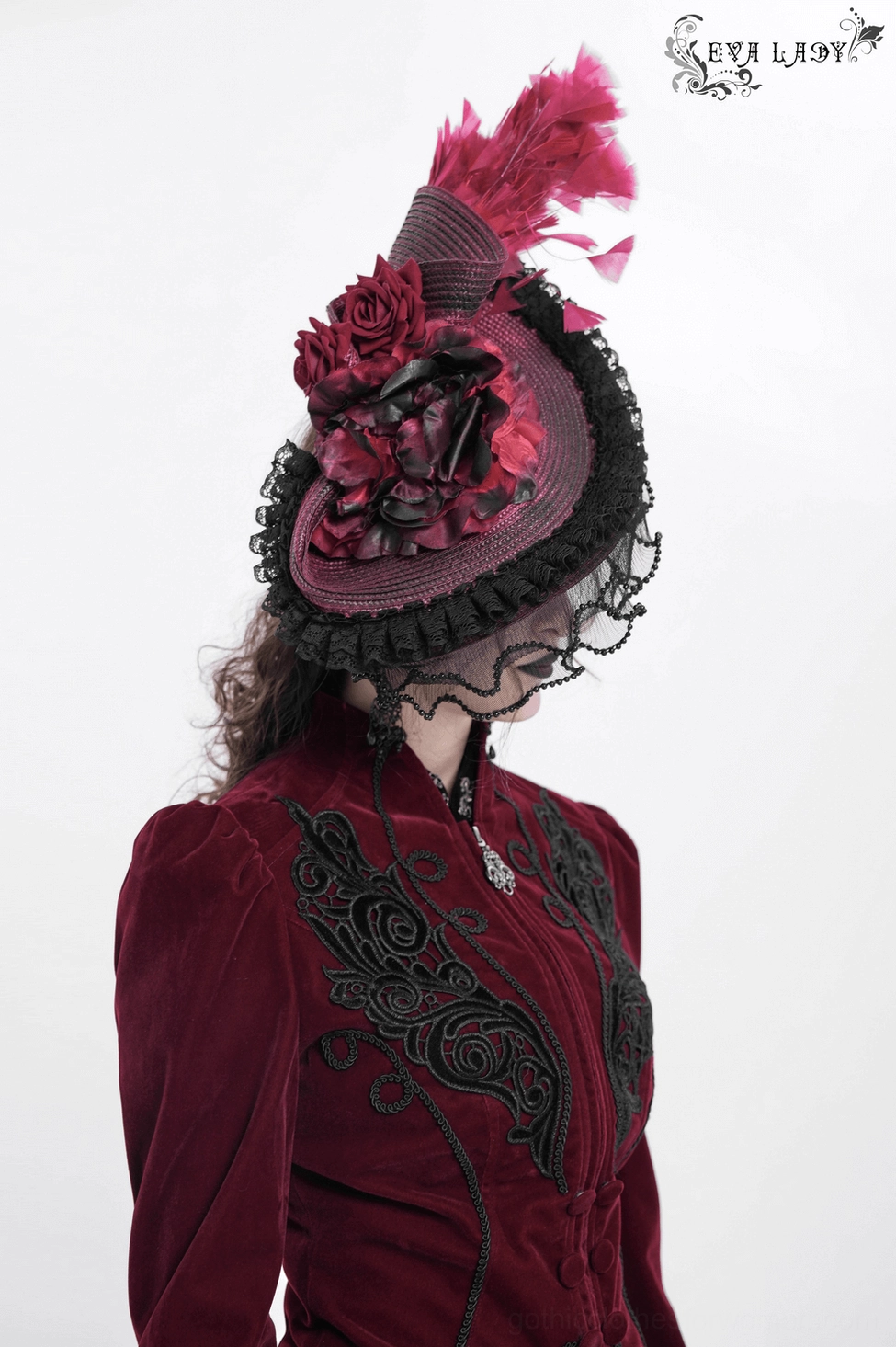 Alternative fashion model showcasing burgundy black gothic fascinator with theatrical dark makeup and confident personal style statement